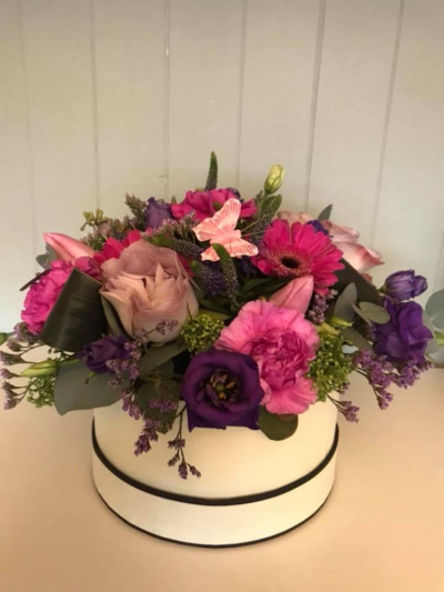 Simply The Best - Vibrant hat box arrangement in a lovely mix of colours. Available for delivery on Mother's day or another day of your choice. 

*Fine Print: Pictures shown are recent examples of an actual arrangement that we designed and later sent out to a customer just like you! Please note that while we don't guarantee what the flower varieties or colours will be, we do guarantee that your specific arrangement