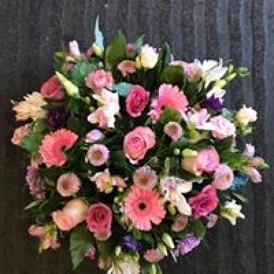 Pink Posy - Posy tribute in mixed flower and shades of pink. Available in a range of sizes.